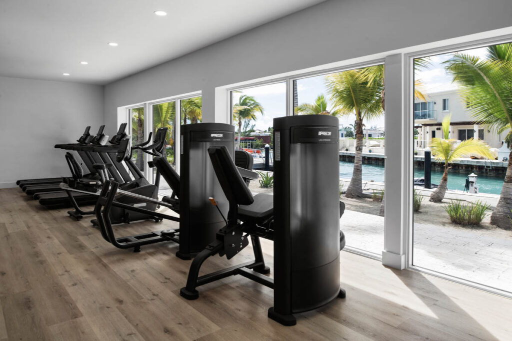 Blue Haven fitness centre cardio equipment overlooking scenic water canal.