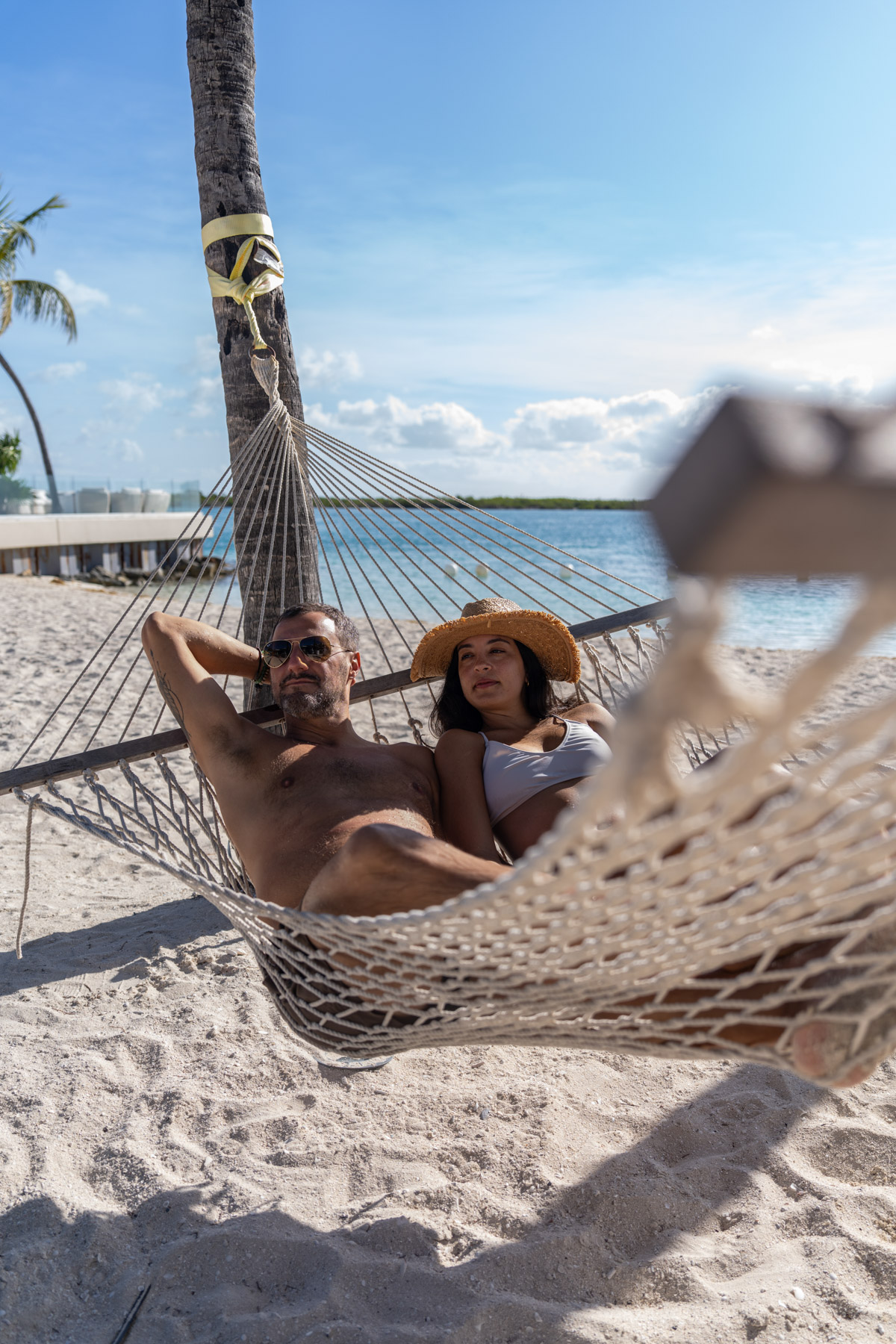 Couple relaxing on the beach at Blue Haven romantic all-inclusive resort Turks and Caicos